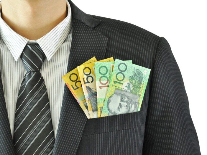 Autralian dollar banknotes in the suit pocket