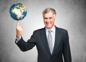 Businessman spinning a globe on his finger